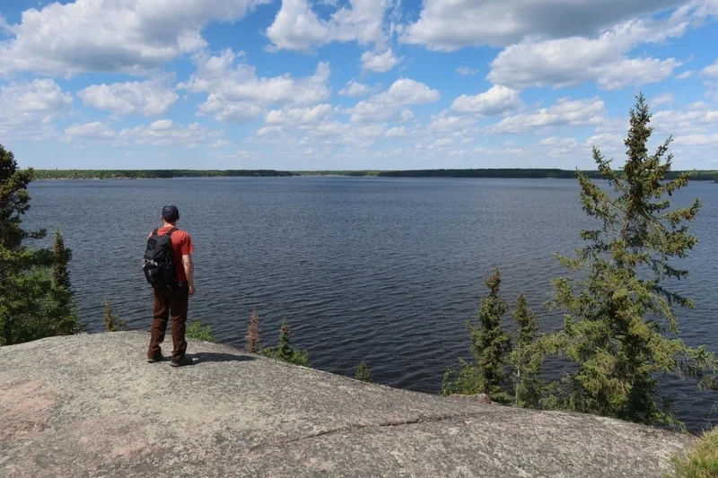 Tour guide overlooking lake