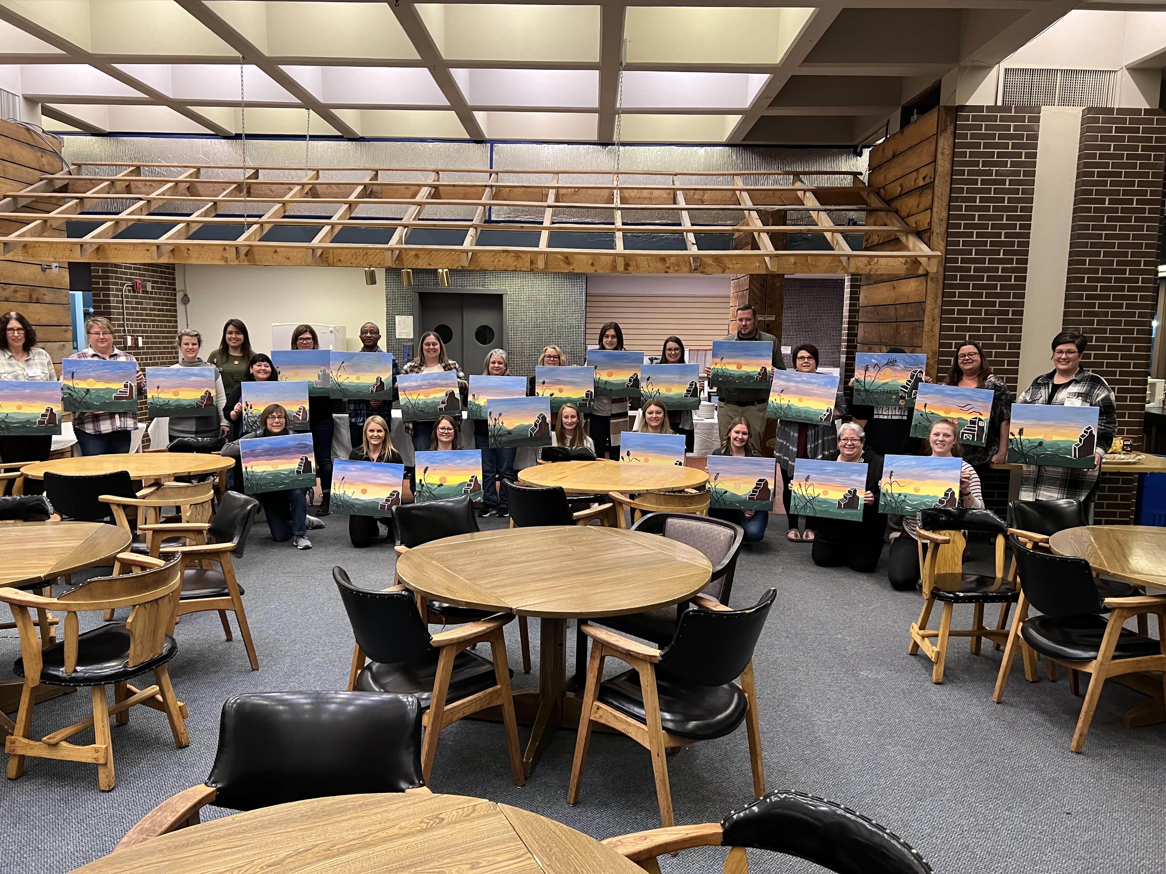 Finished paintings being shown off at paint night